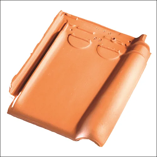 Koramic Tempest 44 clay roof tile in Natural Red, with its curved profile shown on white
