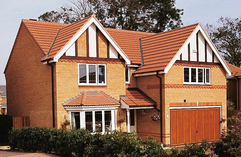 Manufacturer example house roof with Sandtoft Double Roman concrete tiles in Terracotta Red